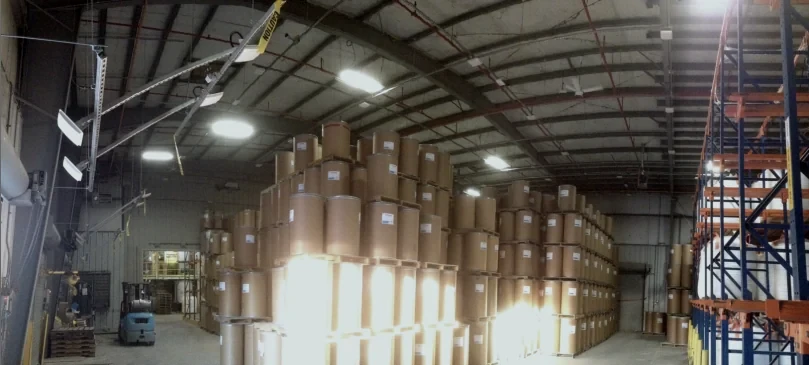 Warehouse with fixed RTLS antennas suspended from the ceiling on a grid